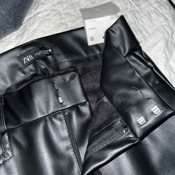 Black faux leather pants. Slight flare. Size S. - Picture 1 of 4